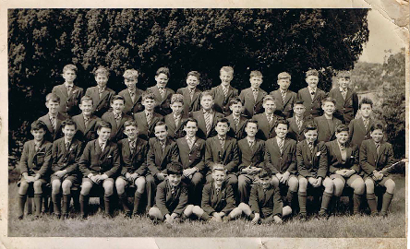 Class photo 1960-61.jpg - Photo supplied by Stephen Z Koral, he didn’t know the exact year this was taken but he said "as I look about 13/14 assume c. 1960/1961". Names from left to right – Sorry if wrong or mis-spelt! Denis O’Keefe, Tommy Kyle, Henry McLauchlan, Sandy Smith, Willie Craven, Peter Innes, Paul Cassidy, Alan Cunningham, Jozef Nigielski ?, ?, Alan Murray, Chris Pope, ?, Malcolm Wyllie, Mike Gallo, ?, ?, Anthony Vandenberg, Brian Hunter, Fred Campbell ?, Mike Donahue, Francis ?  If you can fill in the names of the ? please let us know. 